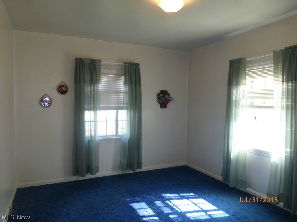 465 Butler Avenue Akron, OH 44310 - Photo 11 of 19 First floor bedroom, hardwood under carpeting.