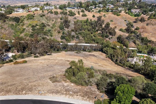 a view of a yard with snow on the road