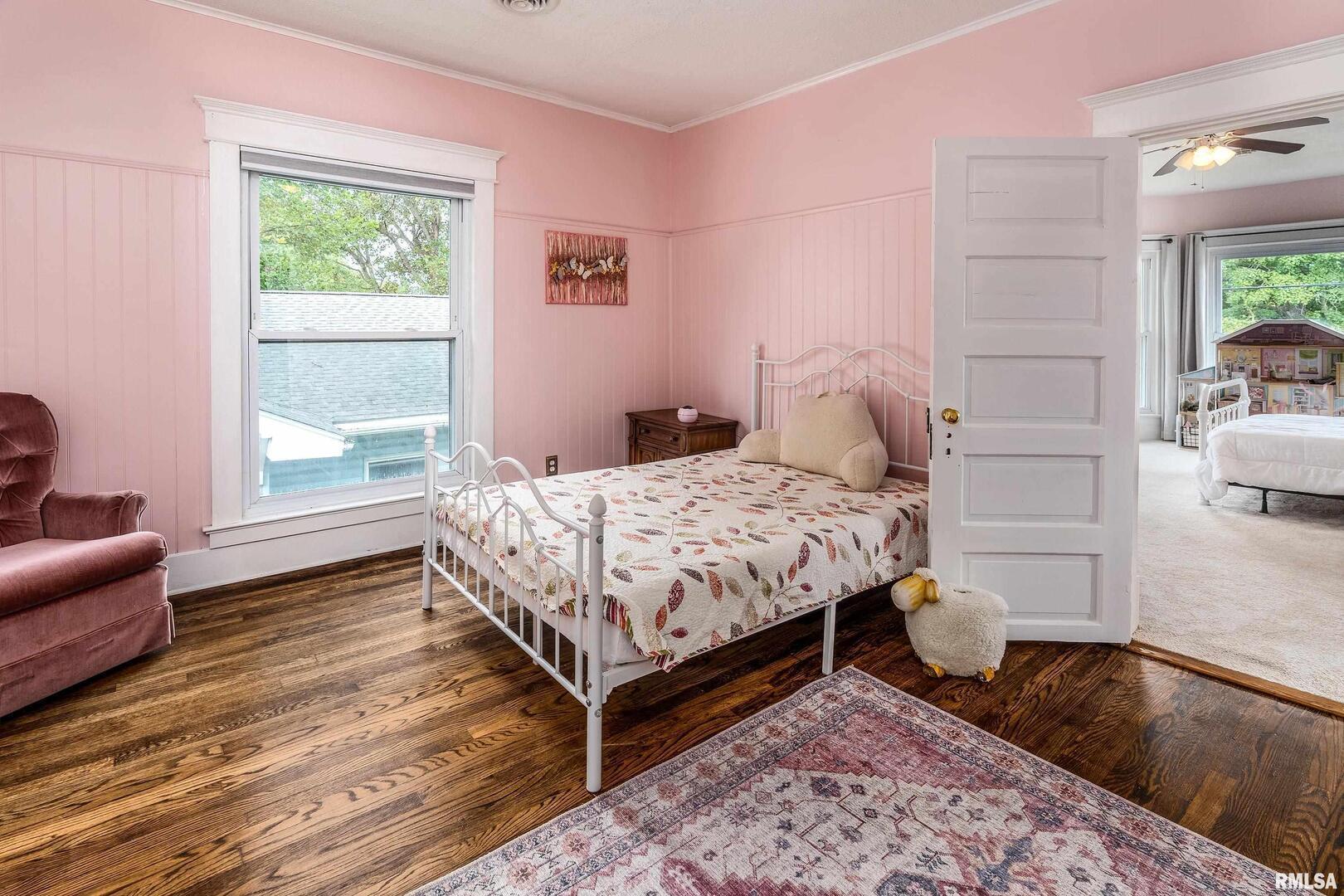 2101 Walnut Street Murphysboro, IL 62966 - Photo 27 of 55 a bedroom with a bed and wooden floor
