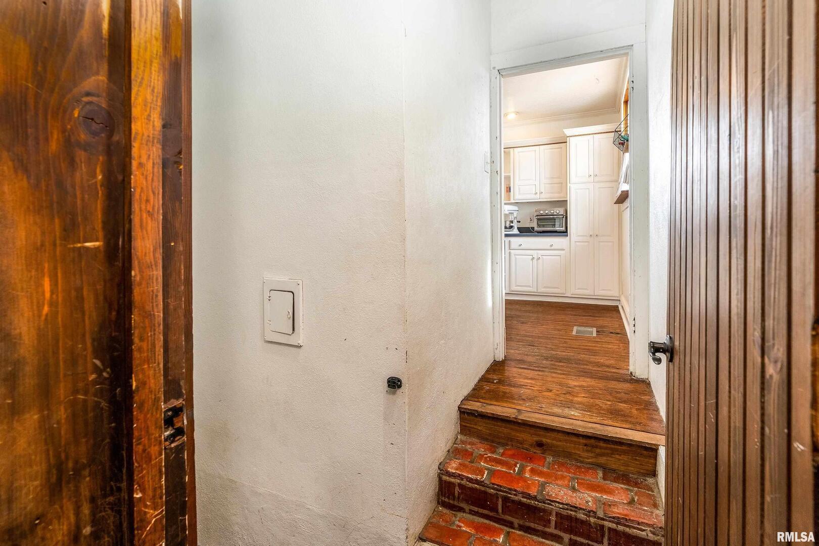2101 Walnut Street Murphysboro, IL 62966 - Photo 33 of 55 a view of a hallway with wooden floor and a bathroom