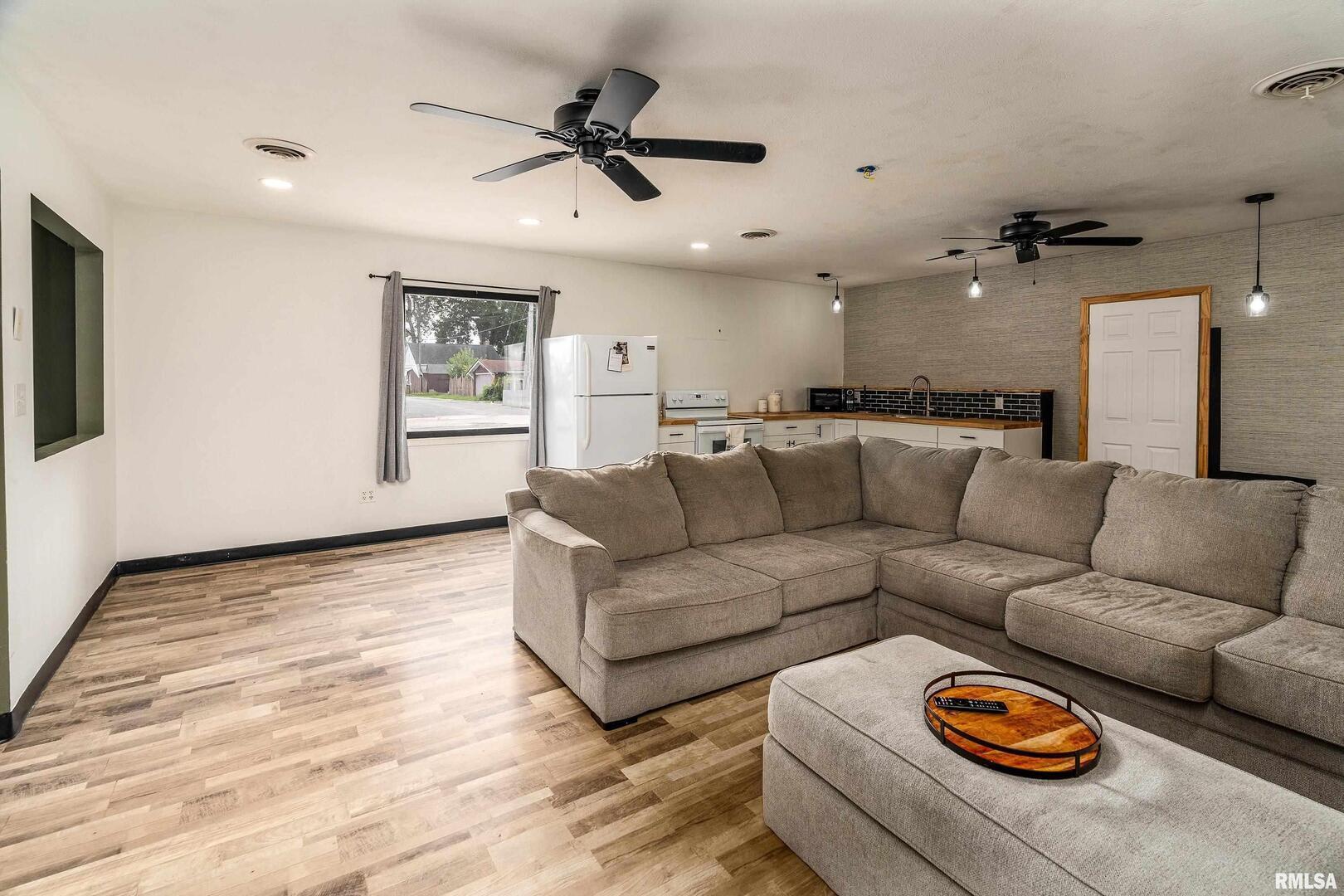 2101 Walnut Street Murphysboro, IL 62966 - Photo 41 of 55 a living room with furniture and a wooden floor