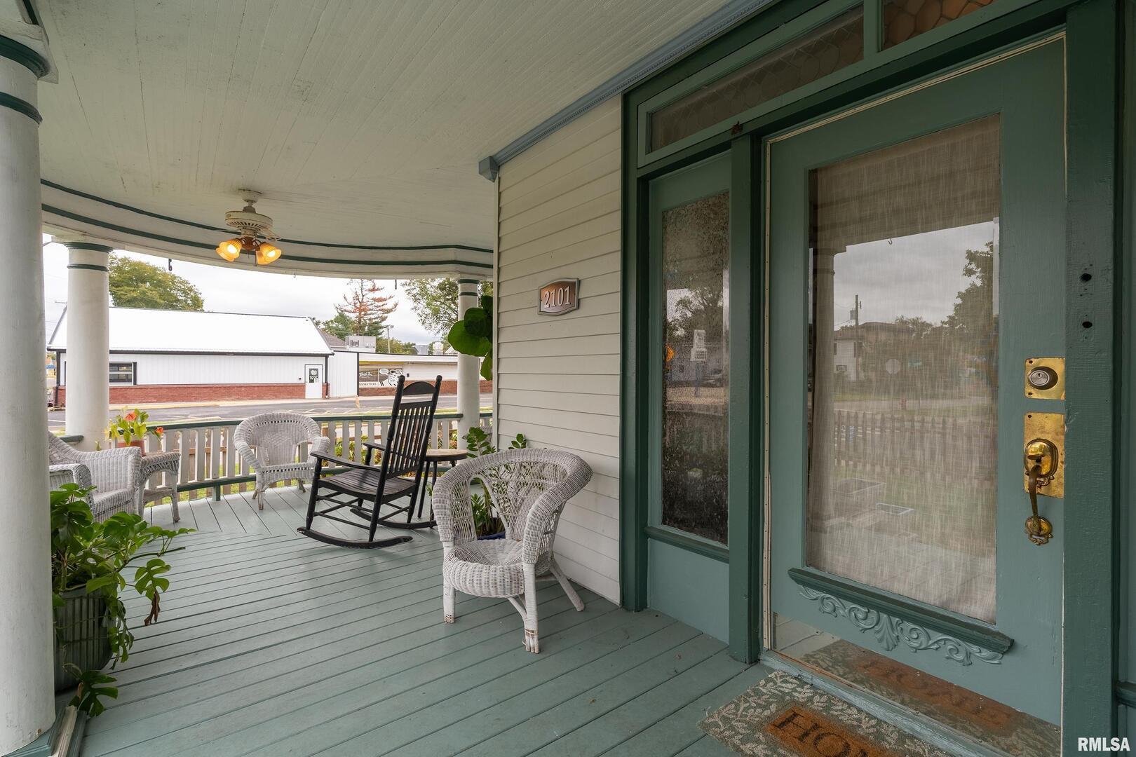 2101 Walnut Street Murphysboro, IL 62966 - Photo 7 of 55 a view of a balcony with chairs and wooden floor