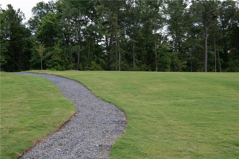 5309 Frontier Court Flowery Branch, GA 30542 - Photo 27 of 30 a view of a field with trees in the background