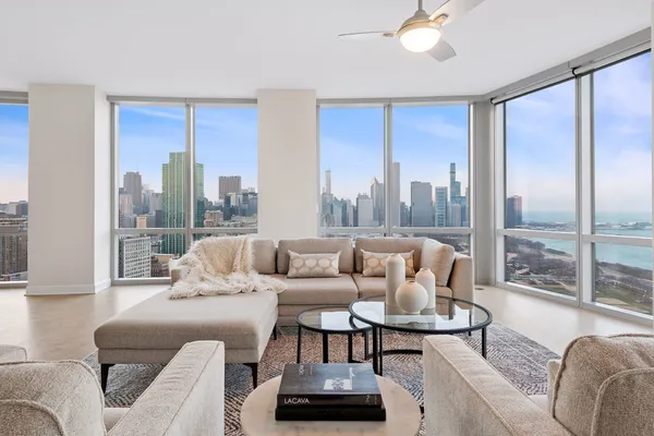 a living room with furniture and a large window