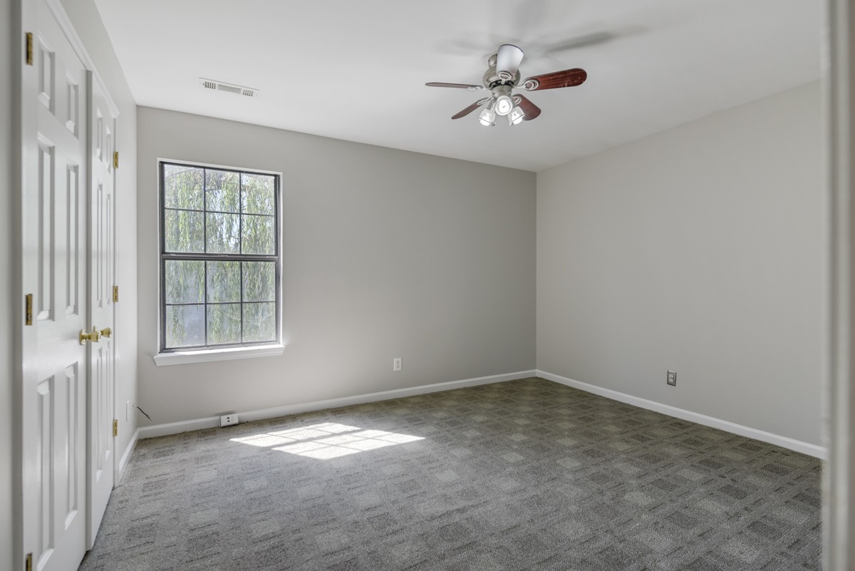 900 Dove Ridge Circle Nashville, TN 37221 - Photo 16 of 24 wooden floor in an empty room with a window