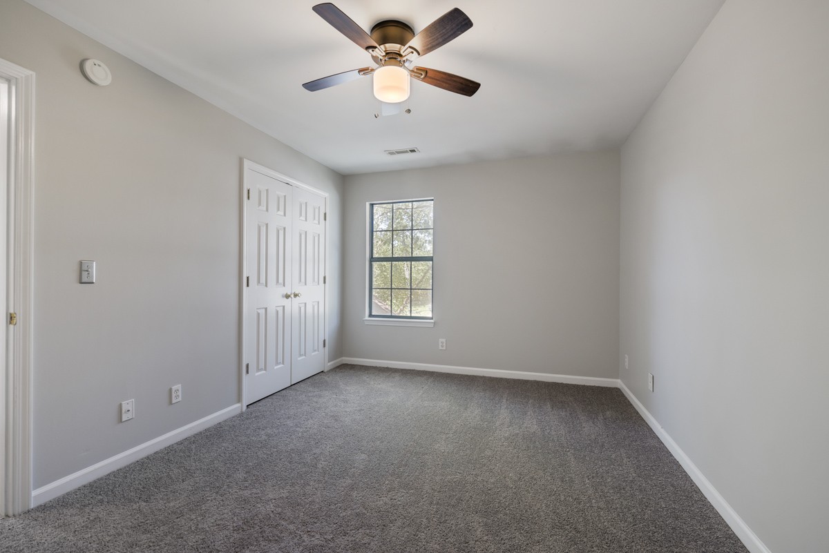 900 Dove Ridge Circle Nashville, TN 37221 - Photo 18 of 24 wooden floor in an empty room with a window