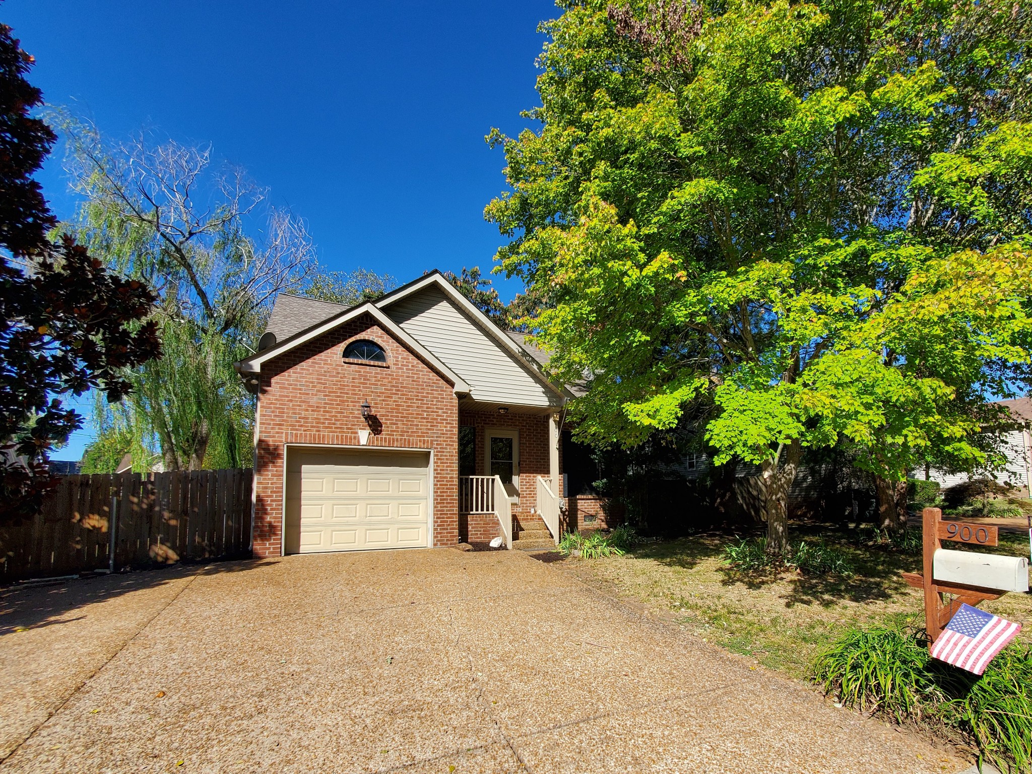 900 Dove Ridge Circle Nashville, TN 37221 - Photo 2 of 24 a front view of a house with a yard and garage