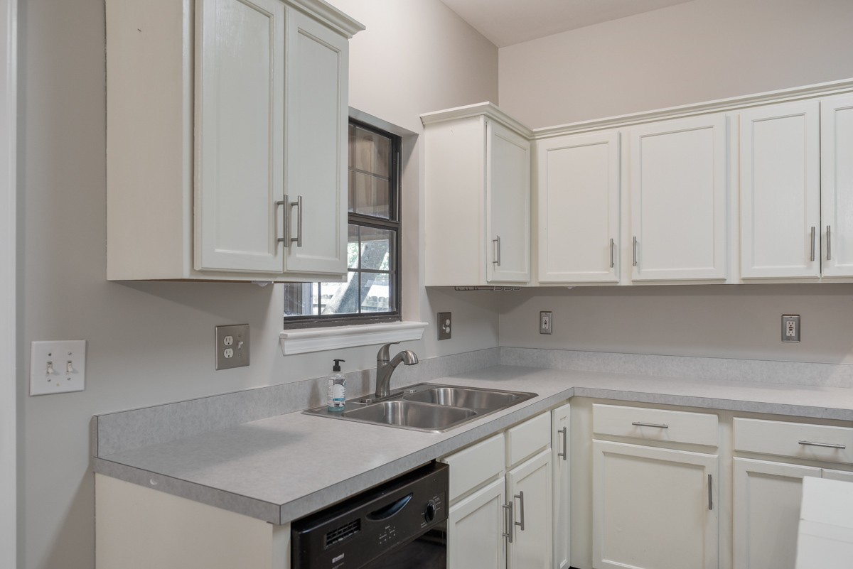 900 Dove Ridge Circle Nashville, TN 37221 - Photo 9 of 24 a kitchen with white cabinets and a sink