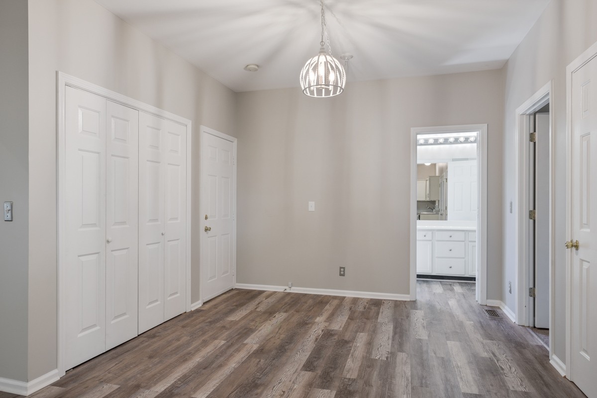 900 Dove Ridge Circle Nashville, TN 37221 - Photo 10 of 24 wooden floor in an empty room with a window