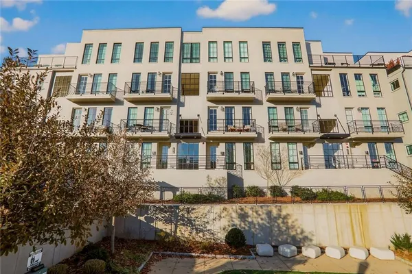 a front view of a building with lake view and city view