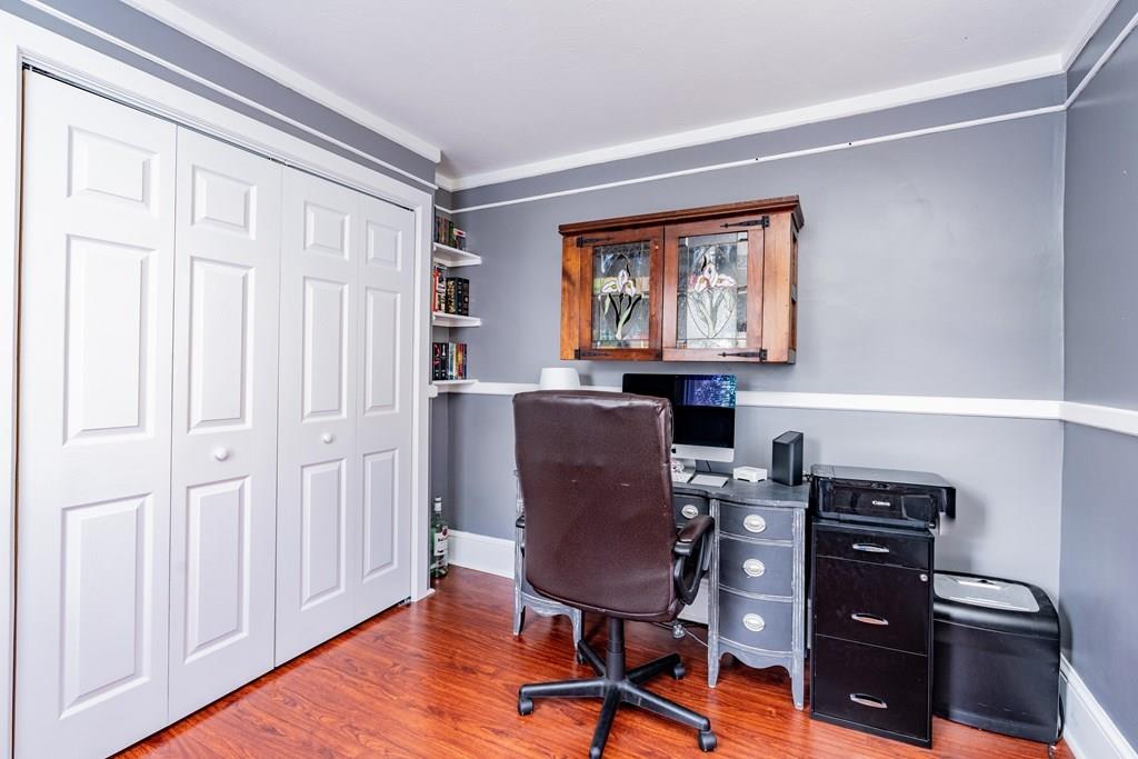 149 Eddy Street Springfield, MA 01104 - Photo 17 of 42 a view of a workspace with furniture and a window