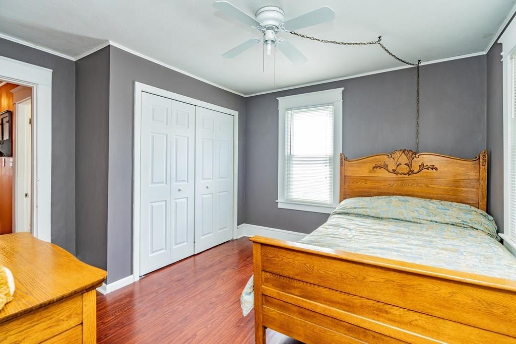149 Eddy Street Springfield, MA 01104 - Photo 20 of 42 a bedroom with a bed and wooden floor