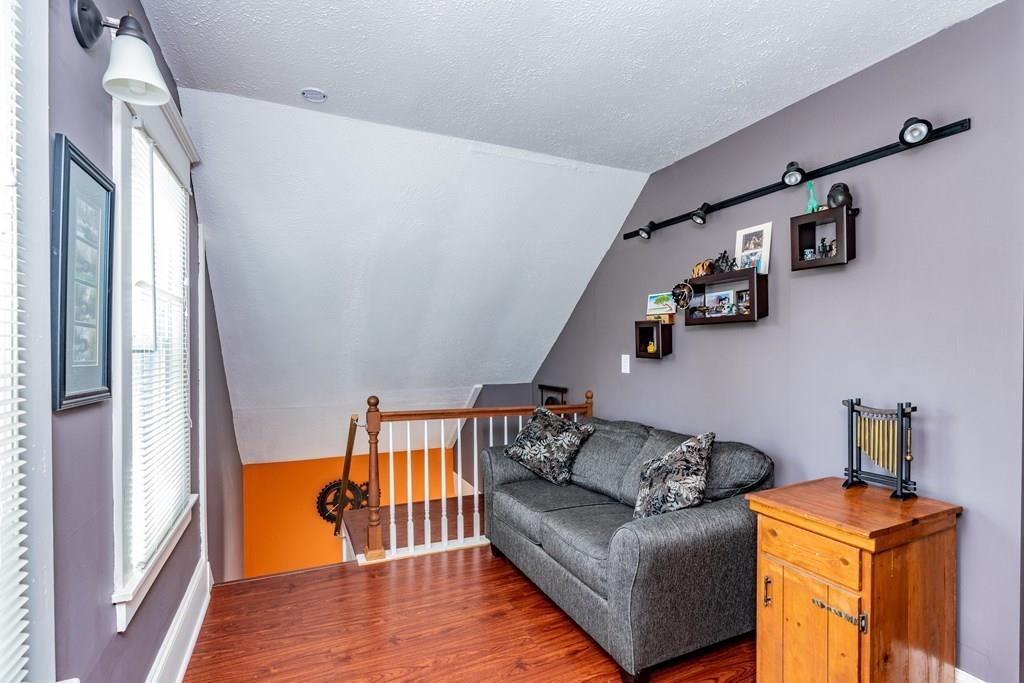 149 Eddy Street Springfield, MA 01104 - Photo 21 of 42 a living room with furniture and a wooden floor