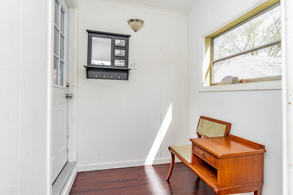 149 Eddy Street Springfield, MA 01104 - Photo 36 of 42 a room with wooden door and wooden floors
