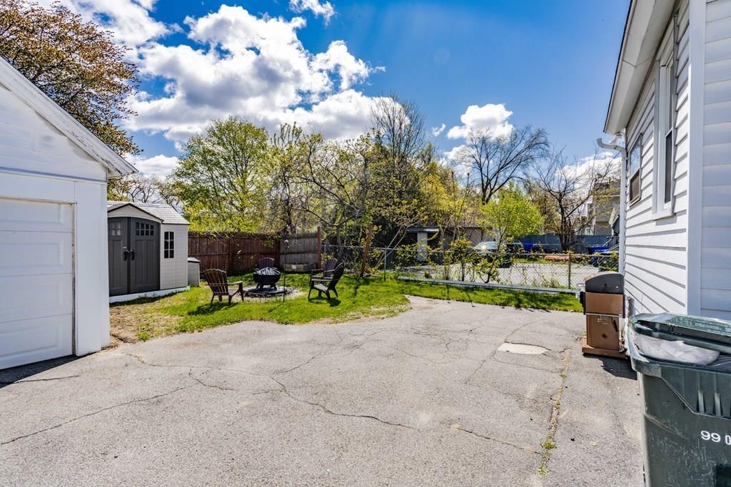 149 Eddy Street Springfield, MA 01104 - Photo 39 of 42 a view of backyard with swimming pool and seating space