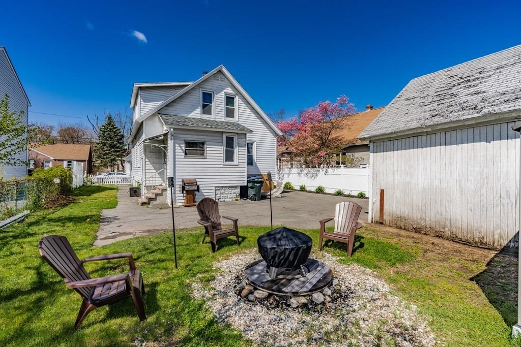 149 Eddy Street Springfield, MA 01104 - Photo 42 of 42 a view of a house with backyard sitting area and garden
