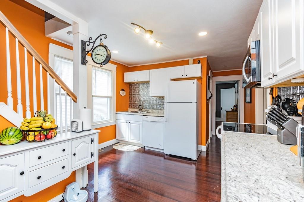 149 Eddy Street Springfield, MA 01104 - Photo 10 of 42 a view of a kitchen with furniture and a window