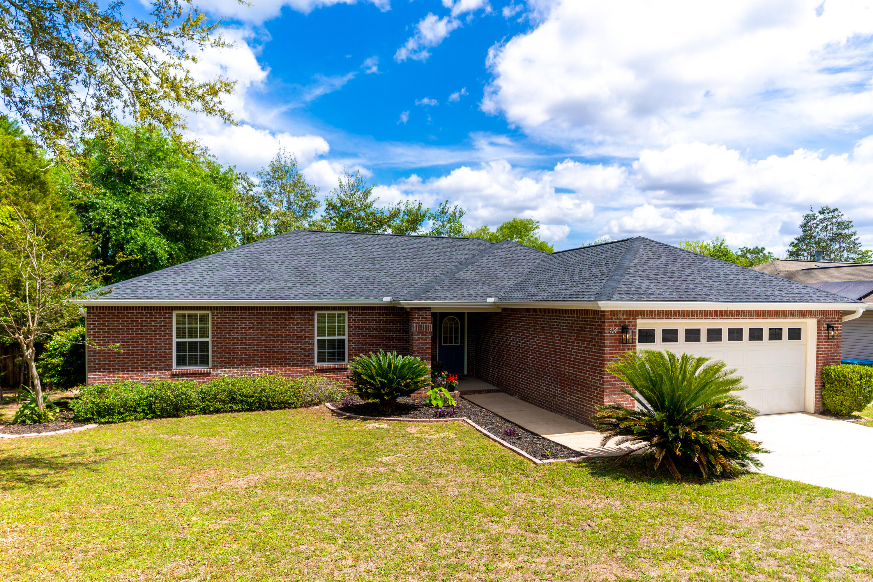 714 Riva Ridge Drive Crestview, FL 32539 - Photo 1 of 37 a front view of a house with a yard