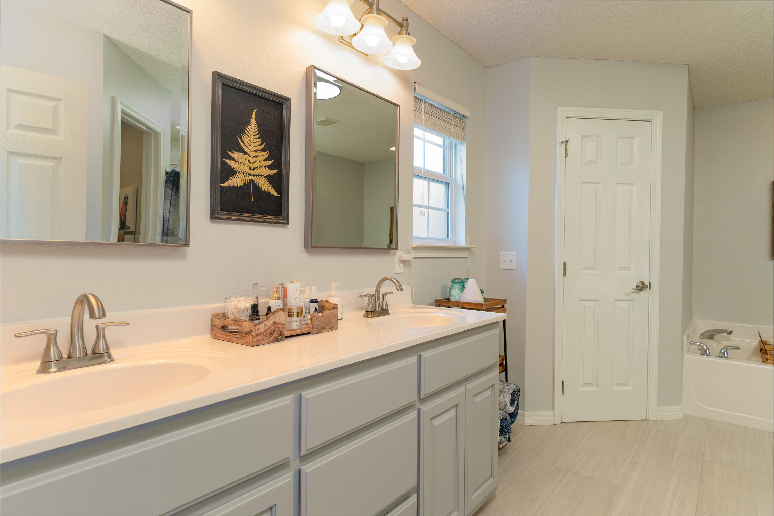 714 Riva Ridge Drive Crestview, FL 32539 - Photo 16 of 37 a bathroom with a sink and a mirror