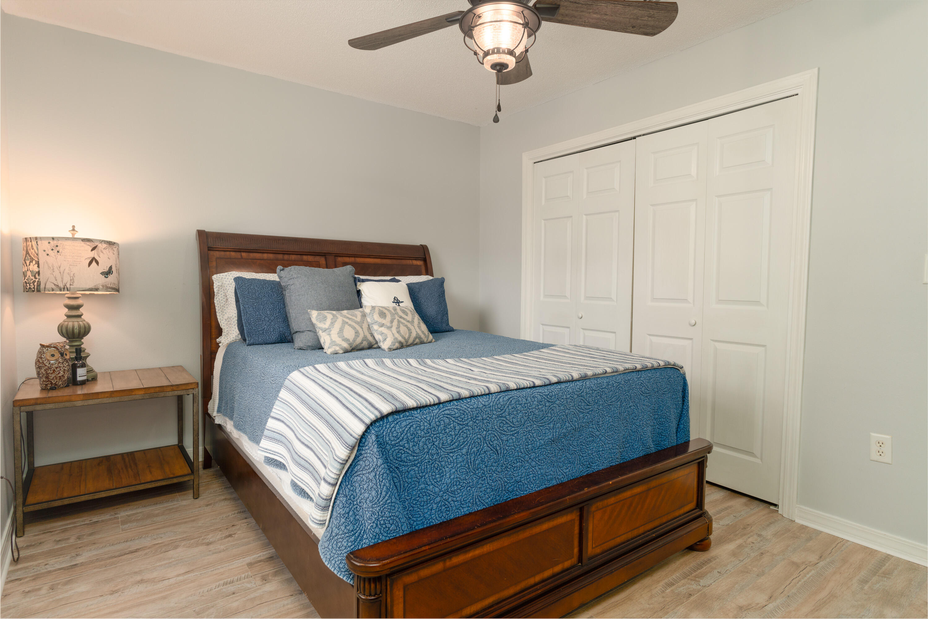 714 Riva Ridge Drive Crestview, FL 32539 - Photo 23 of 37 a bedroom with a bed and a chandelier
