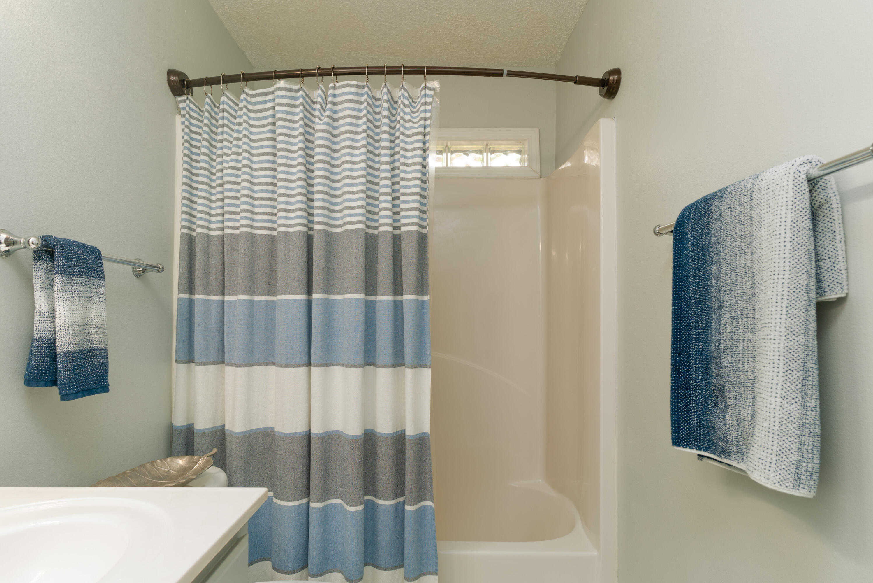 714 Riva Ridge Drive Crestview, FL 32539 - Photo 28 of 37 a bathroom with a bathtub and a shower