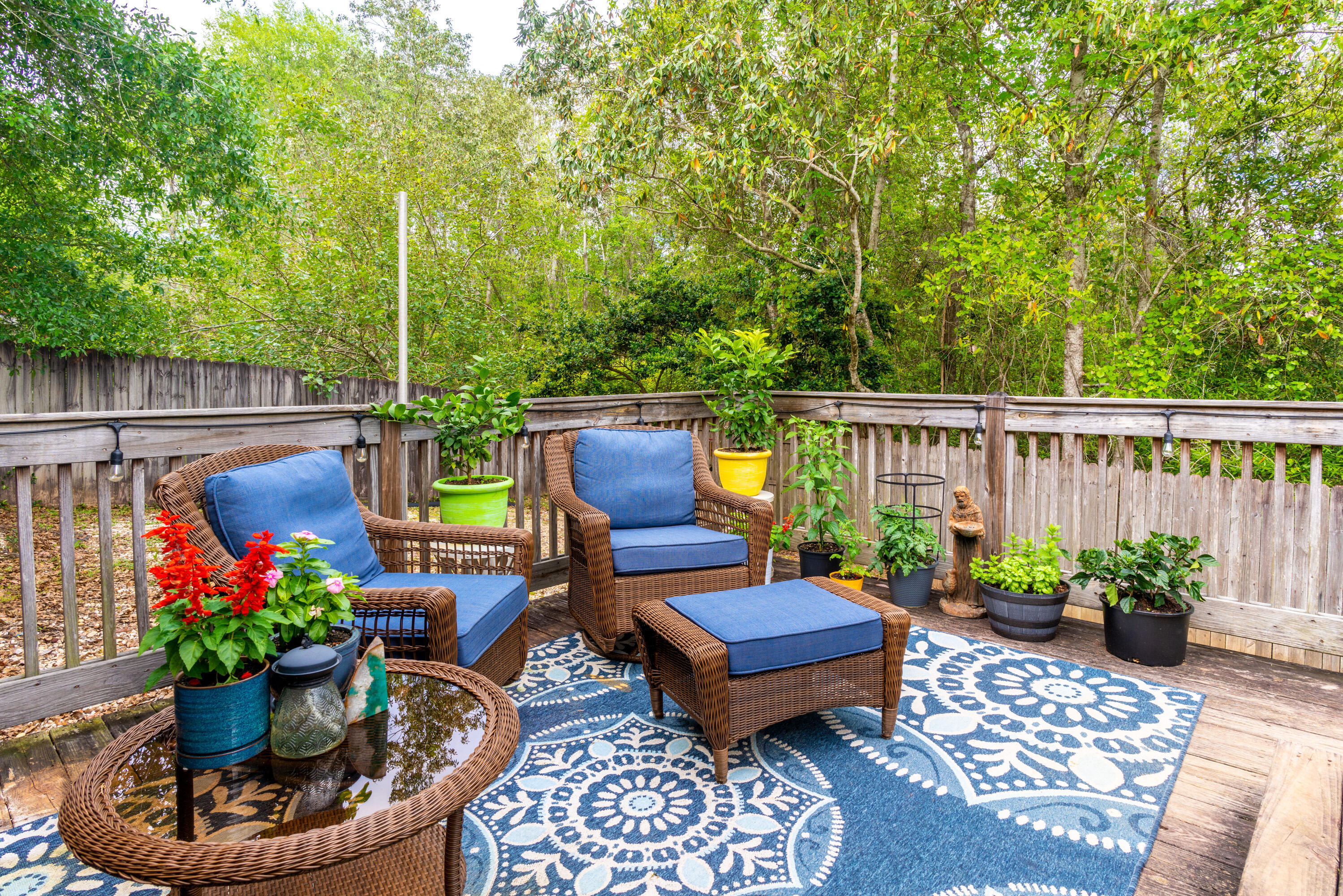 714 Riva Ridge Drive Crestview, FL 32539 - Photo 30 of 37 a view of a patio with furniture and flowers