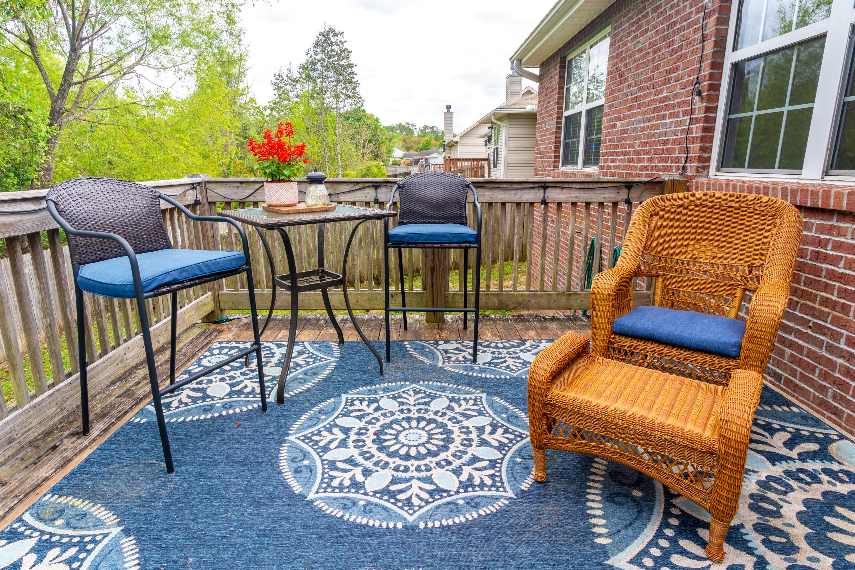 714 Riva Ridge Drive Crestview, FL 32539 - Photo 33 of 37 a view of a patio with a table chairs and a potted plants