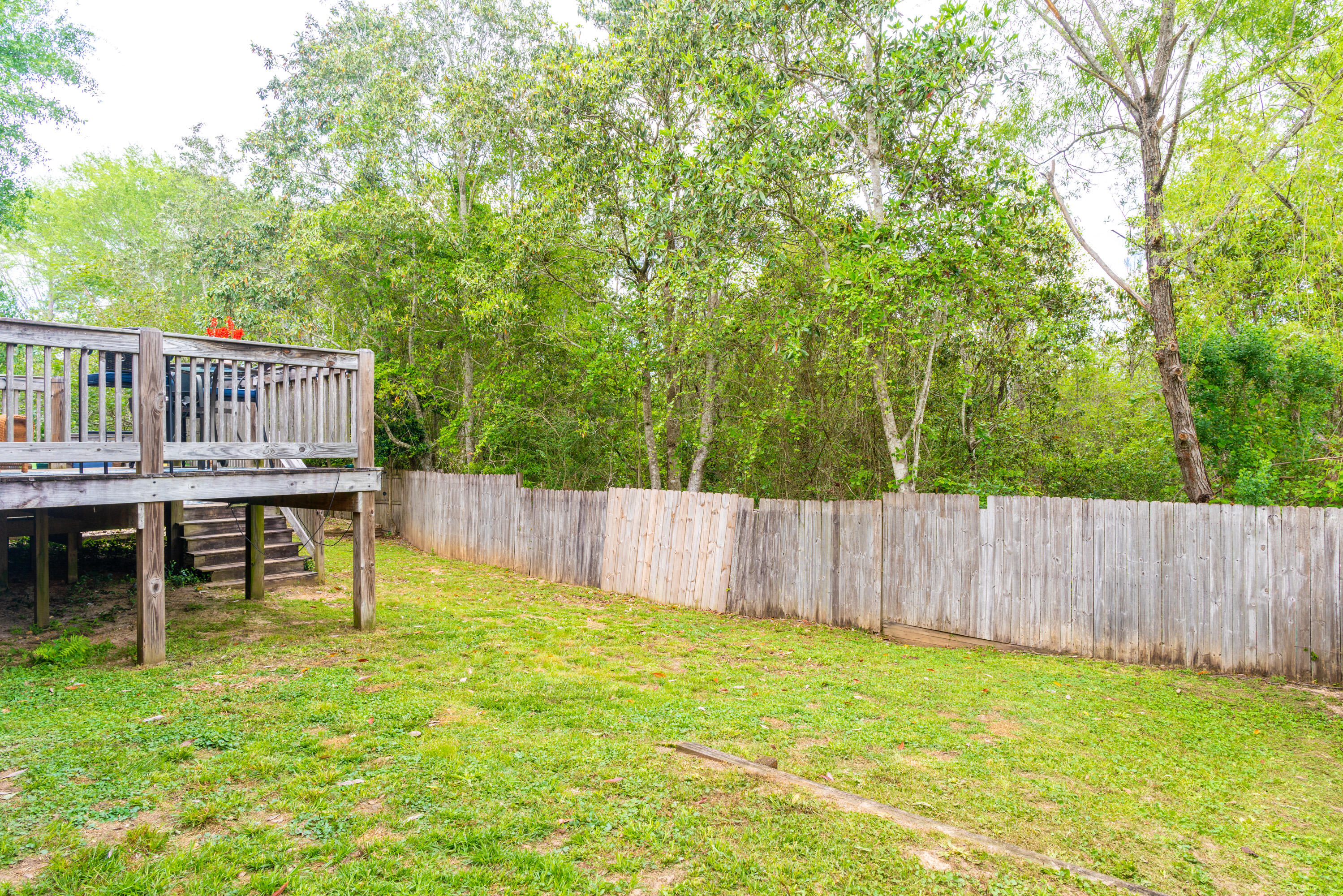 714 Riva Ridge Drive Crestview, FL 32539 - Photo 36 of 37 a view of a chair and table in the backyard