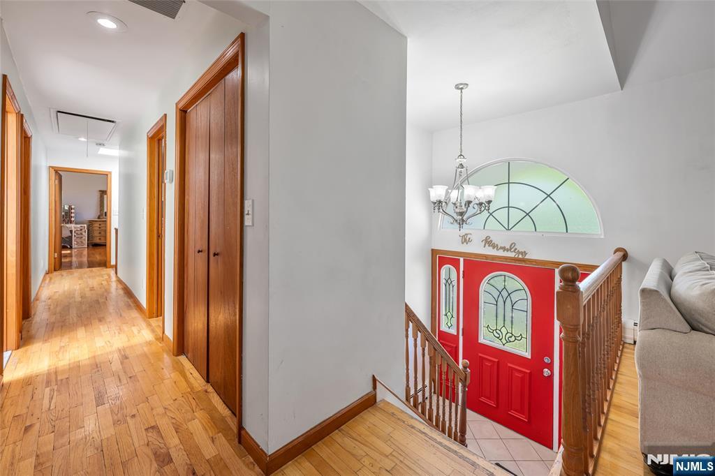 21 Marcia Road Ringwood, NJ 07456 - Photo 4 of 42 a view of hallway with wooden floor