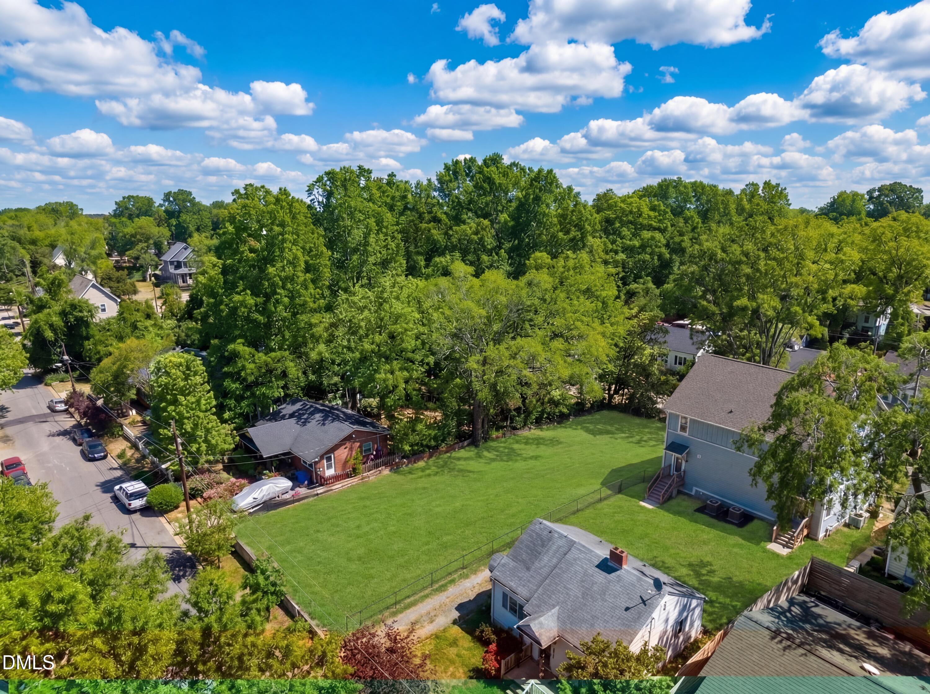 516 North Maple Street Durham, NC 27703 - Photo 3 of 15 an aerial view of a house with garden