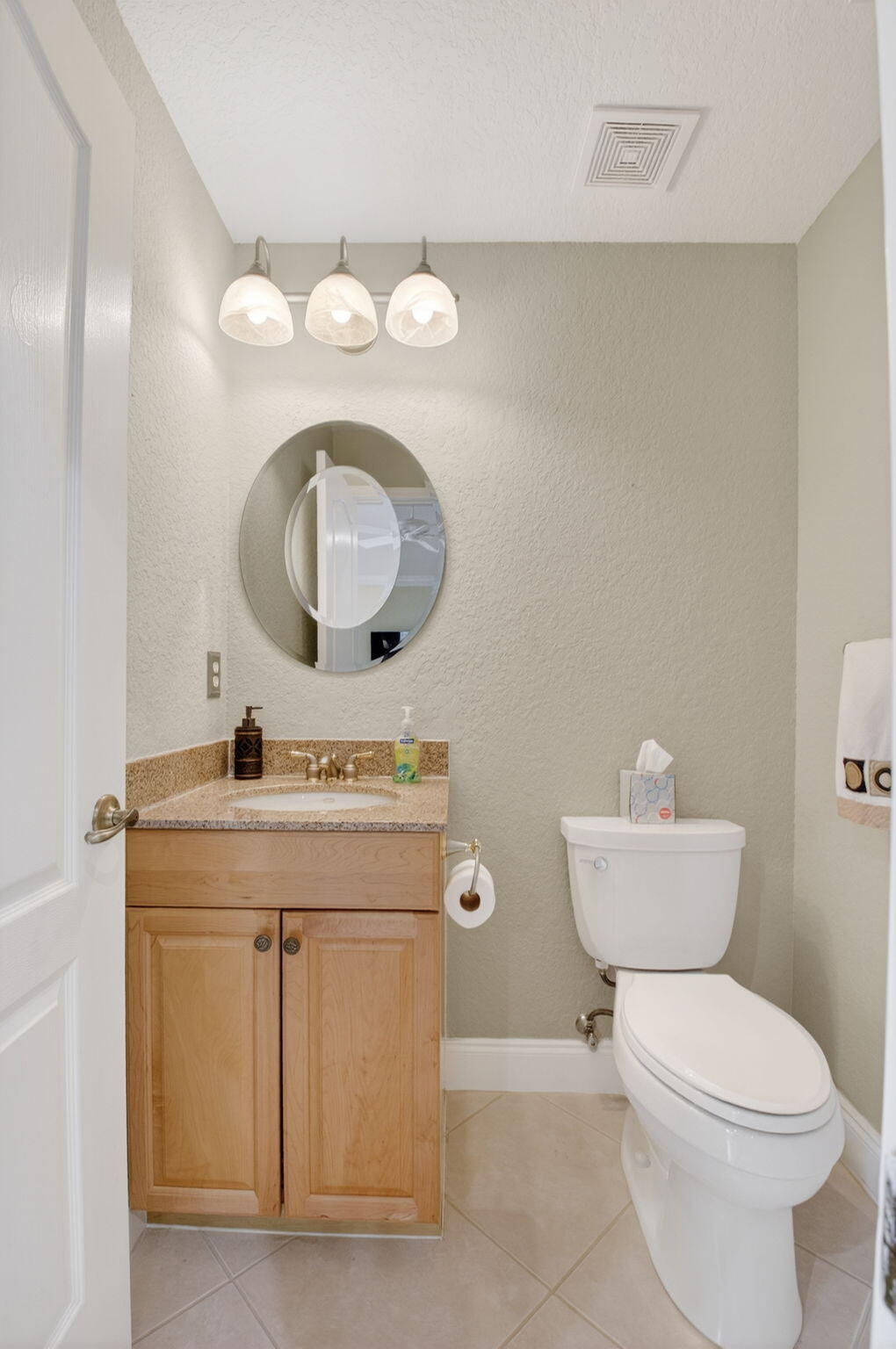 8286 Duomo Circle Boynton Beach, FL 33472 - Photo 18 of 79 a bathroom with a toilet a sink and mirror