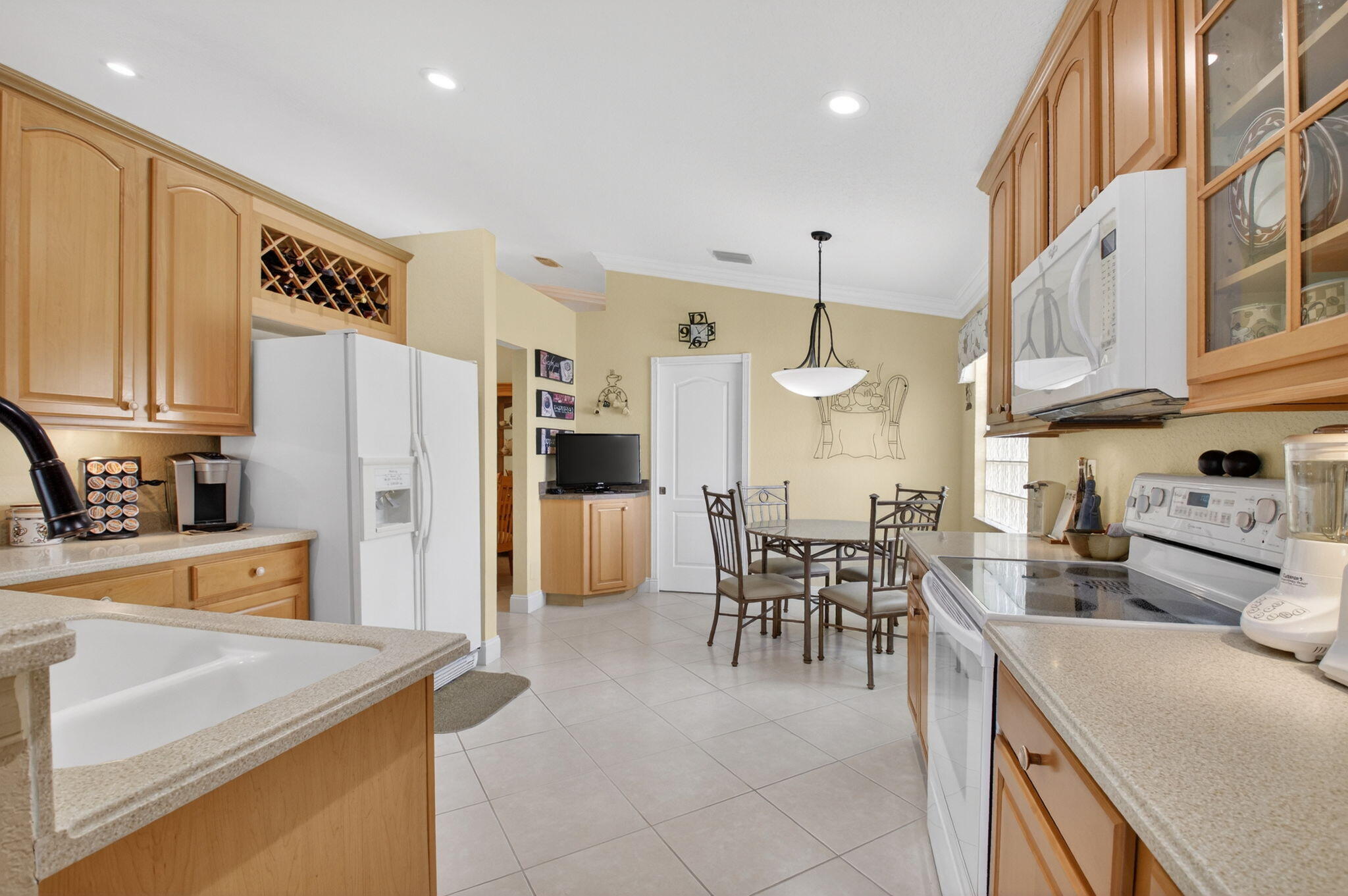 8286 Duomo Circle Boynton Beach, FL 33472 - Photo 20 of 79 a kitchen with refrigerator and cabinets