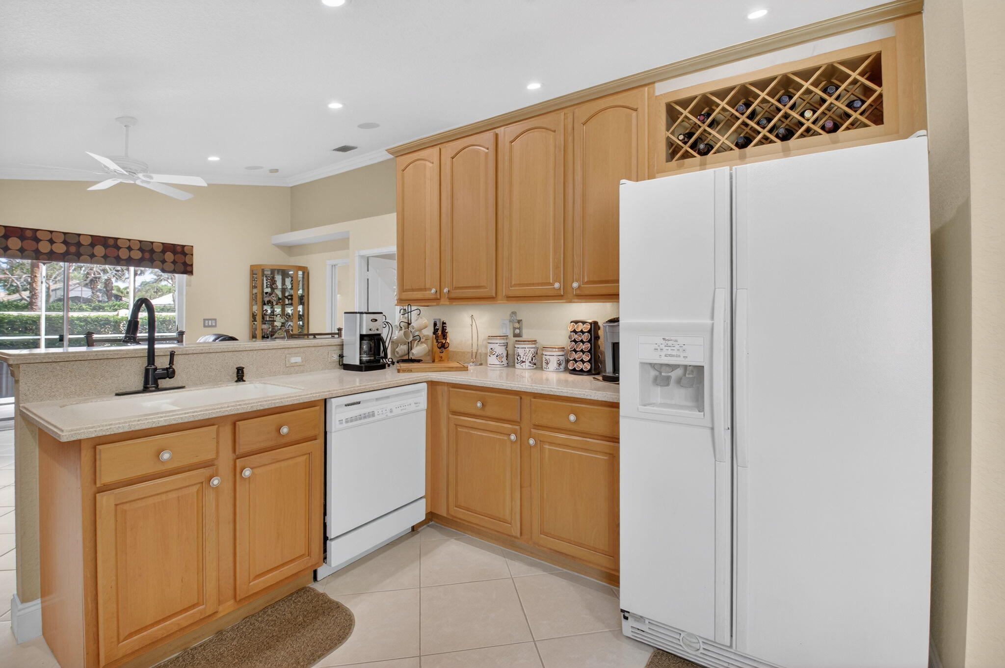 8286 Duomo Circle Boynton Beach, FL 33472 - Photo 21 of 79 a kitchen with a sink a refrigerator and cabinets