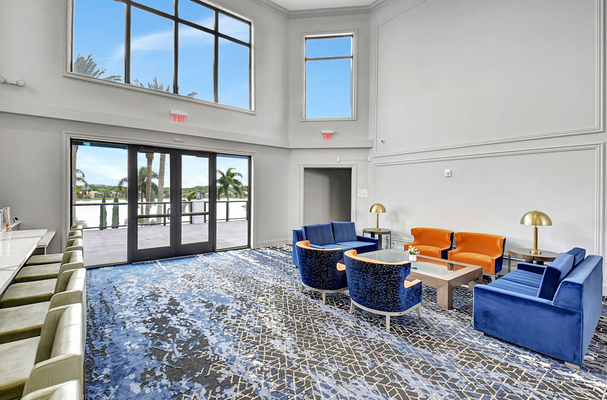 8286 Duomo Circle Boynton Beach, FL 33472 - Photo 58 of 79 a living room with furniture a flat screen tv and floor to ceiling window