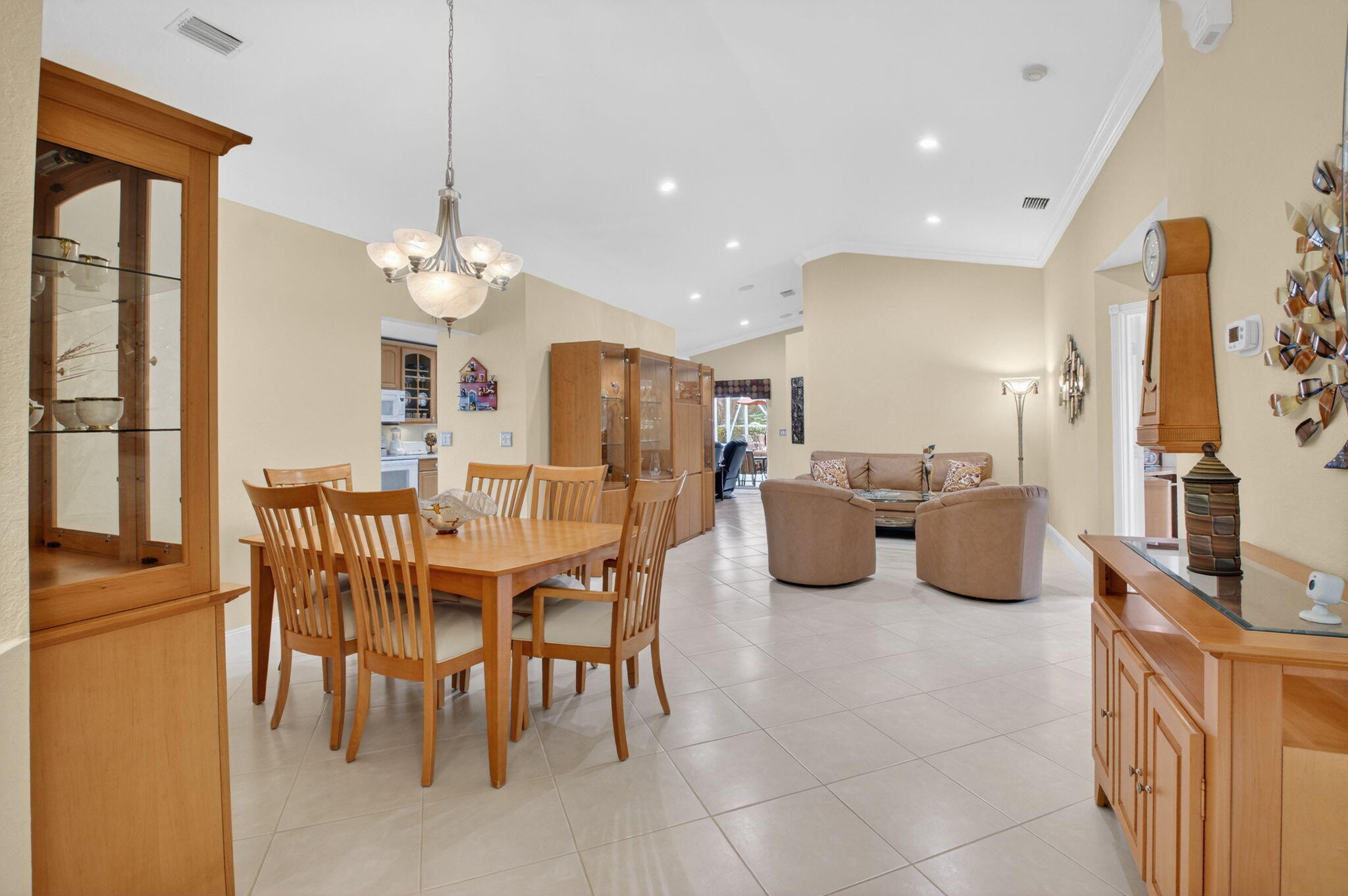 8286 Duomo Circle Boynton Beach, FL 33472 - Photo 8 of 79 a view of a dining room with furniture and chandelier
