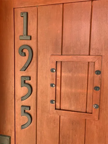 a bathroom with a granite countertop sink and a shower