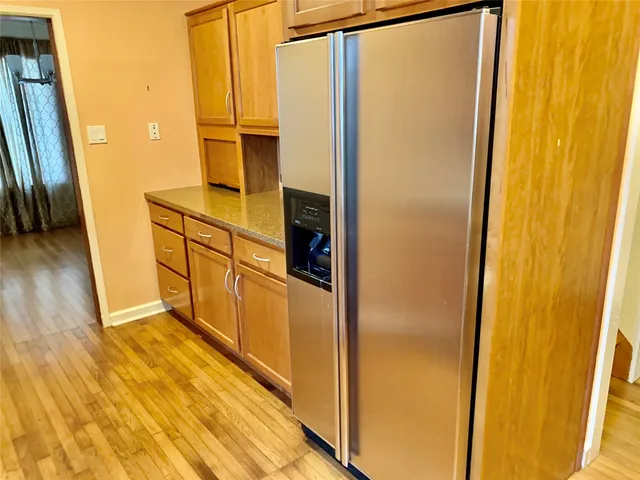 a view of a kitchen from the hallway