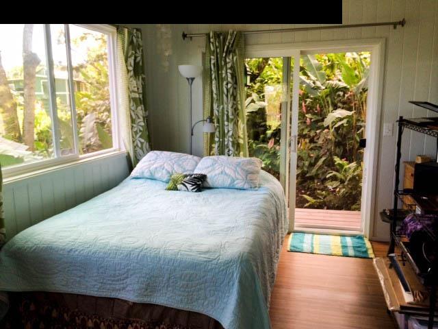 1010 Nahiku Road Hana, HI 96713 - Photo 8 of 13 a bedroom with a bed and a window