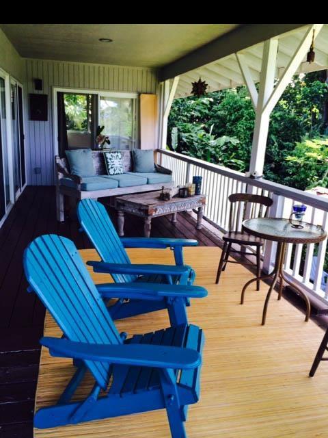 1010 Nahiku Road Hana, HI 96713 - Photo 9 of 13 a view of a patio with table and chairs with wooden floor and fence