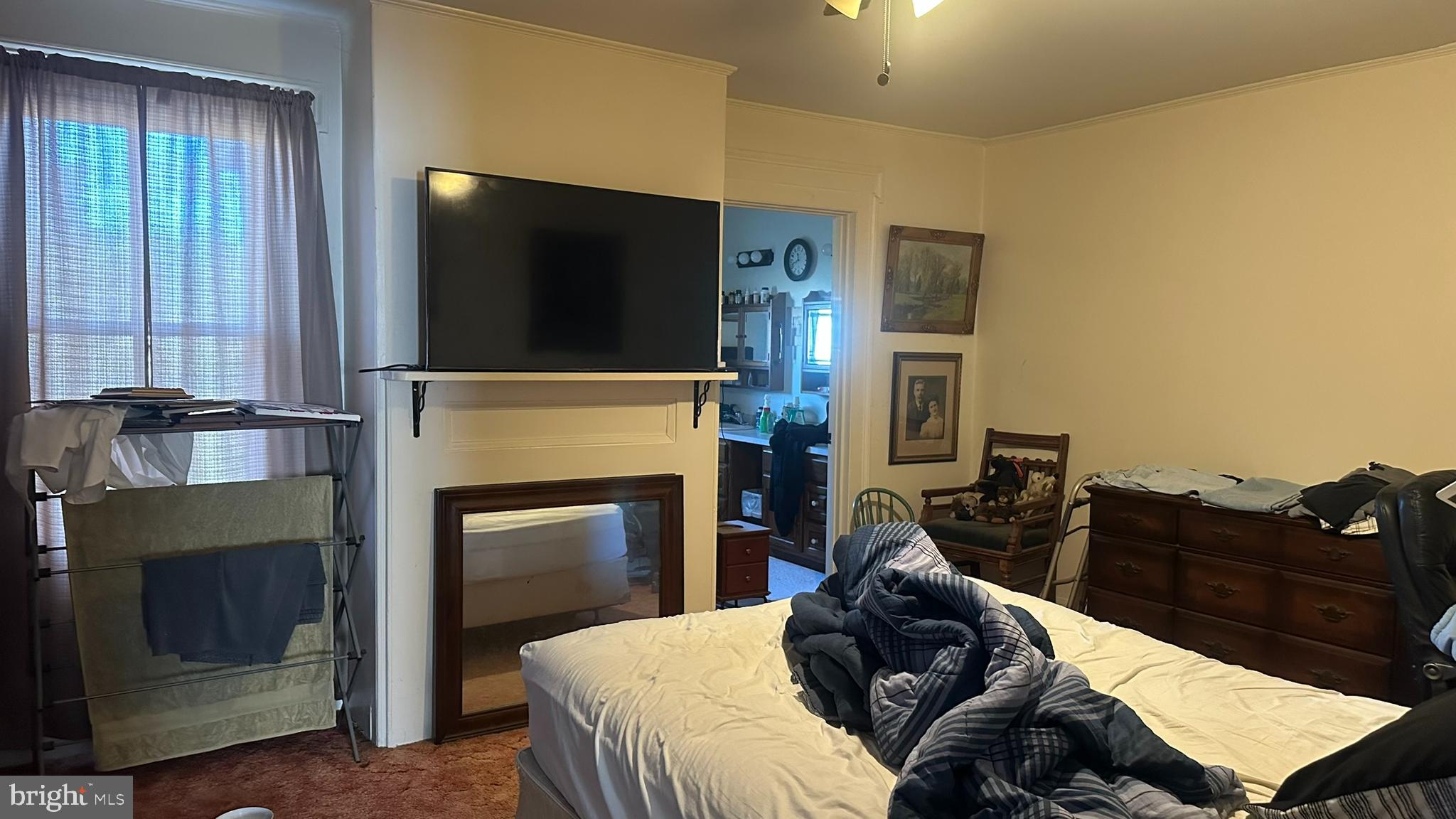 295 North North Main Street Manahawkin, NJ 08050 - Photo 9 of 17 a living room with furniture a fireplace and a flat screen tv