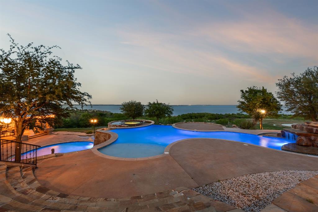 1180 McReynolds Road Sanger, TX 76266 - Photo 32 of 40 Multi-tiered pool with integrated spa and rock waterfall feature