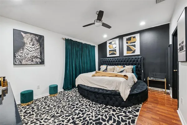 a bedroom with a bed and a table