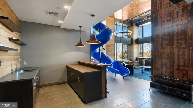 a outdoor space with lots of chairs and a table