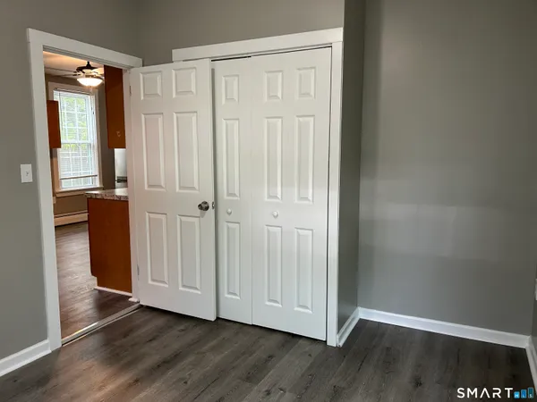 an empty room with wooden floor