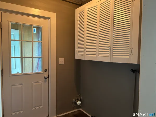 a view of a room that has a window in it