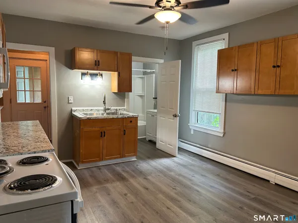 a kitchen with a stove and a refrigerator