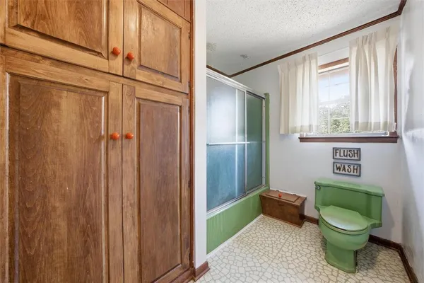 a bathroom with a toilet and a sink