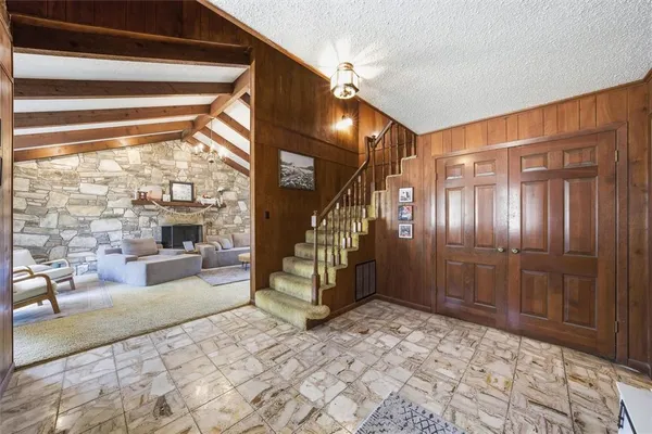 a room with lots of windows and furniture