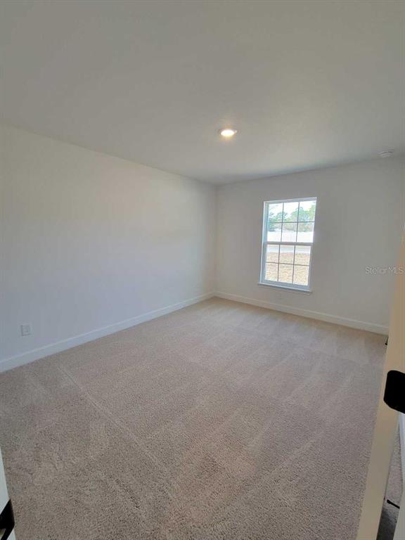 7035 Southwest 131st Loop Ocala, FL 34473 - Photo 20 of 28 an empty room with windows