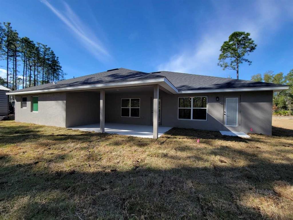 7035 Southwest 131st Loop Ocala, FL 34473 - Photo 25 of 28 a view of a house with a yard